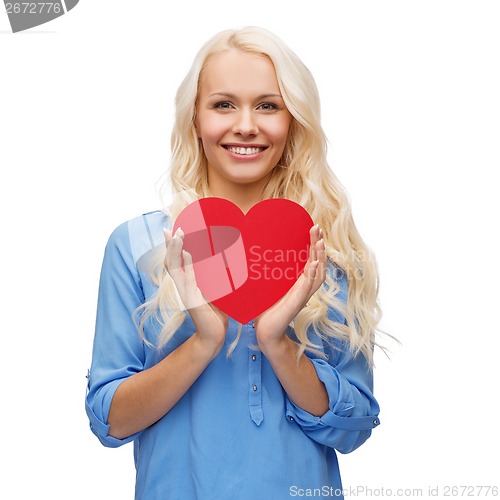 Image of smiling woman with red heart