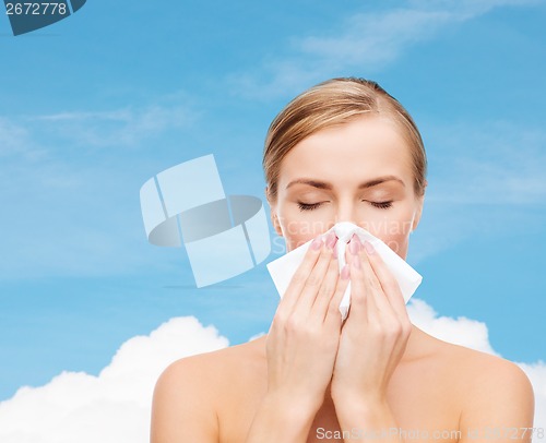 Image of beautiful woman with paper tissue