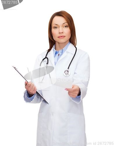 Image of calm female doctor with clipboard