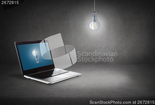 Image of laptop computer with light bulb on screen