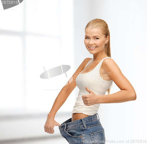 Image of sporty woman showing big pants