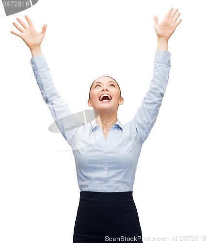 Image of laughing businesswoman waving hands