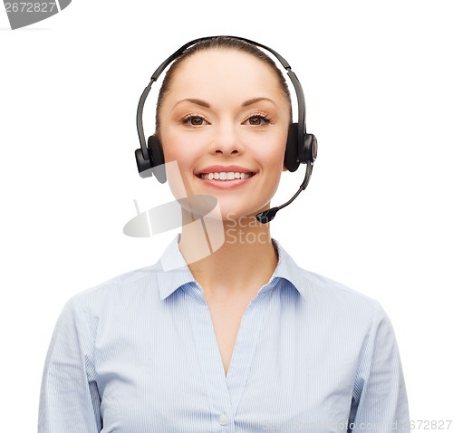 Image of friendly female helpline operator with headphones
