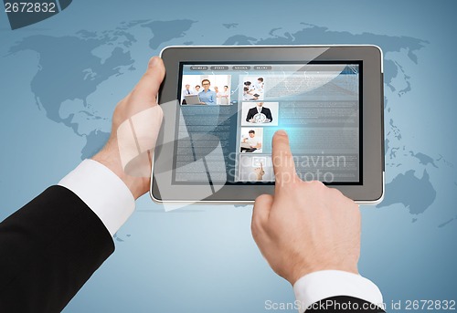 Image of close up of man hands touching tablet pc