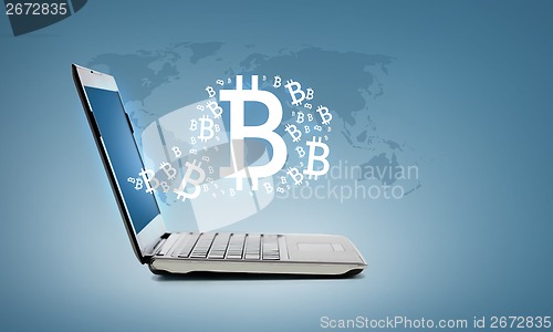 Image of laptop computer with bitcoin