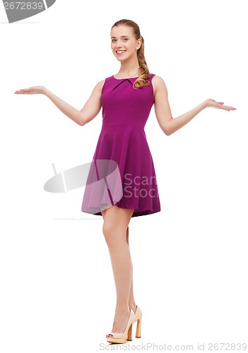 Image of young woman in purple dress and high heels