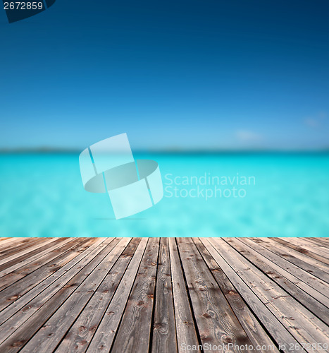 Image of wooden floor and blue sea