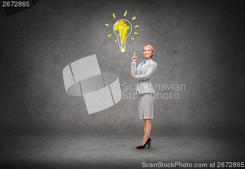 Image of attractive young businesswoman with her finger up
