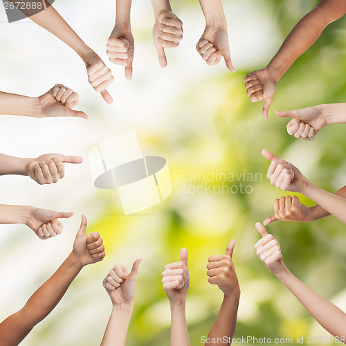 Image of human hands showing thumbs up in circle