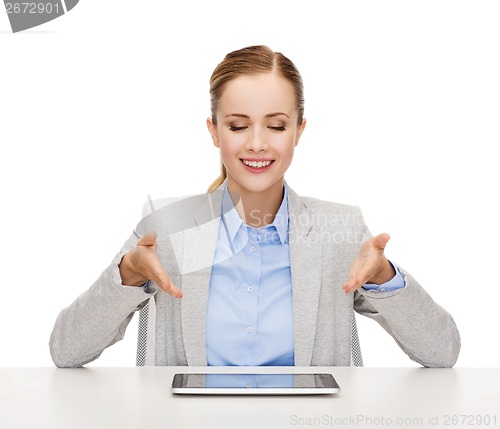 Image of smiling businesswoman with tablet pc