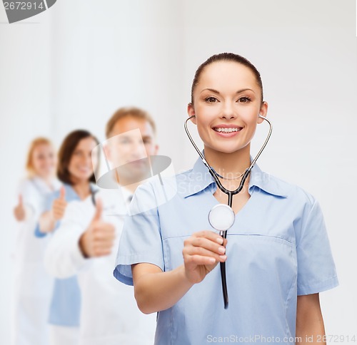 Image of smiling female doctor or nurse with stethoscope