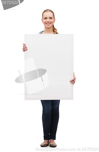 Image of smiling young woman with white blank board