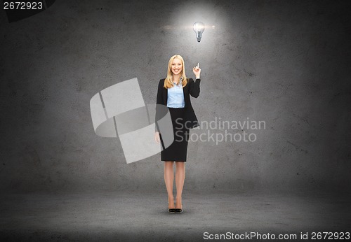 Image of attractive young businesswoman with her finger up