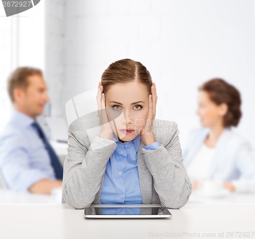 Image of smiling businesswoman with tablet pc