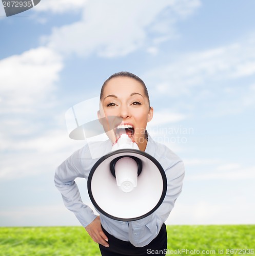 Image of screaming businesswoman with megaphone