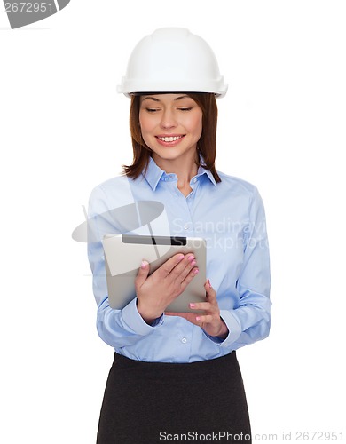 Image of young smiling businesswoman in white helmet