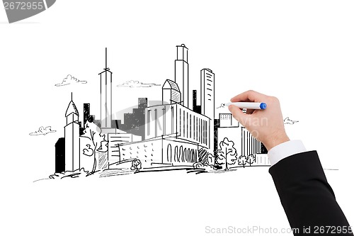 Image of close up of businessman drawing city sketch