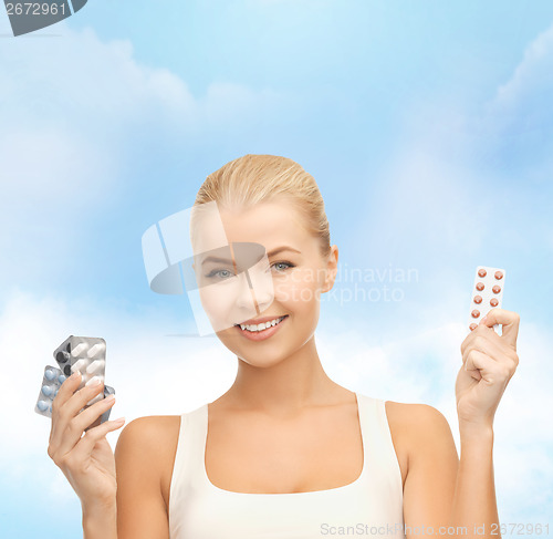 Image of young woman with pills