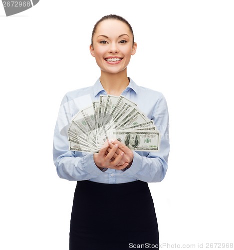 Image of young businesswoman with dollar cash money