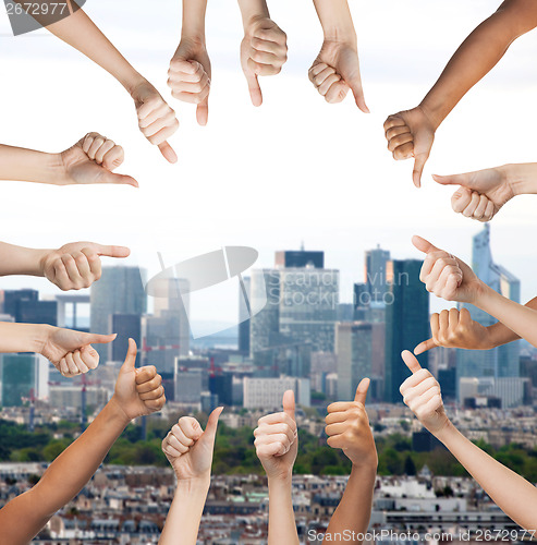 Image of human hands showing thumbs up in circle