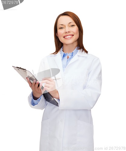 Image of smiling female doctor with clipboard