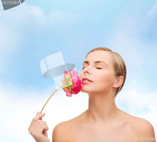 Image of lovely woman with peonie flower