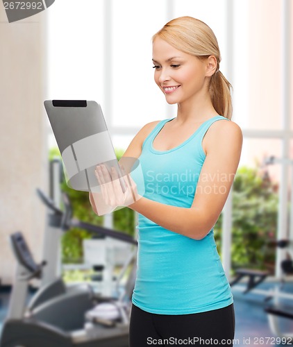 Image of sporty woman with tablet pc