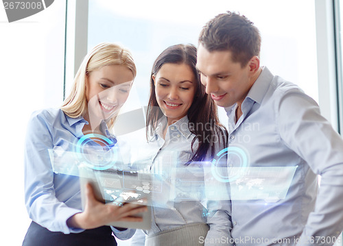 Image of business team working with tablet pc in office