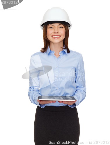 Image of young businesswoman in white helmet with tablet pc