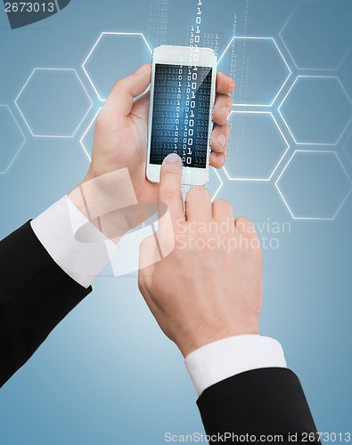 Image of businessman touching screen of smartphone