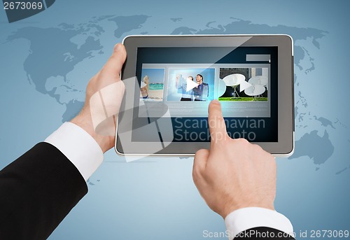 Image of close up of man hands touching tablet pc