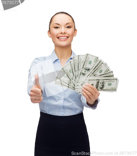 Image of young businesswoman with dollar cash money