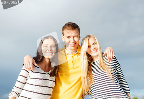 Image of group of friends having fun on the beach