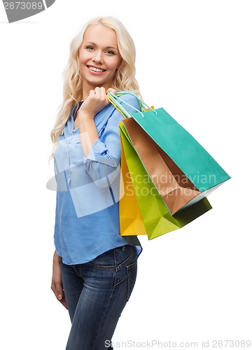 Image of smiling woman with many shopping bags
