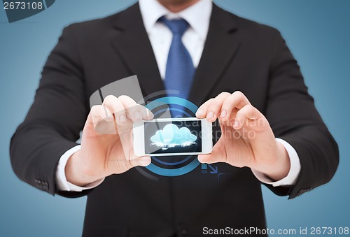 Image of businessman showing smartphone with blank screen