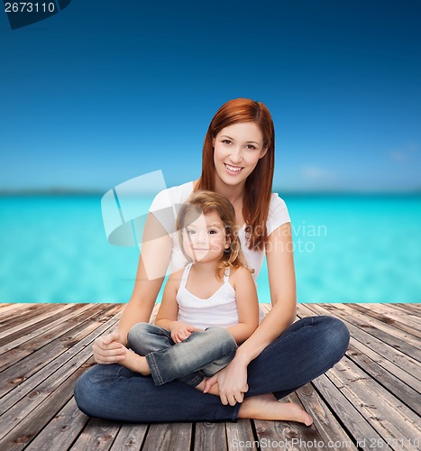 Image of happy mother with adorable little girl