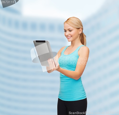 Image of sporty woman with tablet pc