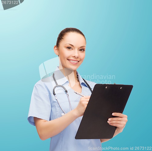 Image of smiling female doctor or nurse with stethoscope