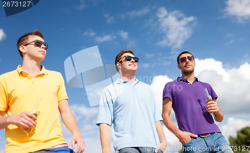 Image of group of male friends with bottles of beer