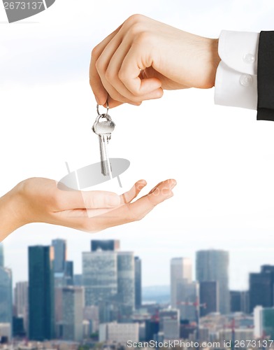 Image of close up of man and woman with house keys