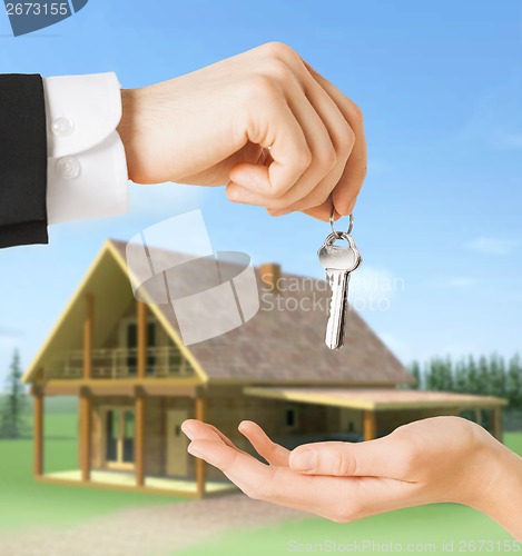 Image of close up of man and woman with house keys