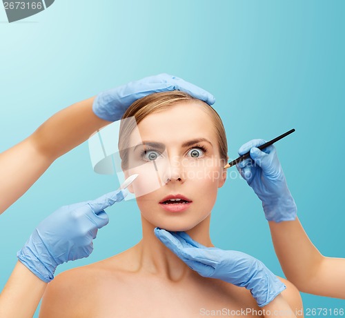 Image of woman face and beautician hands with pencil