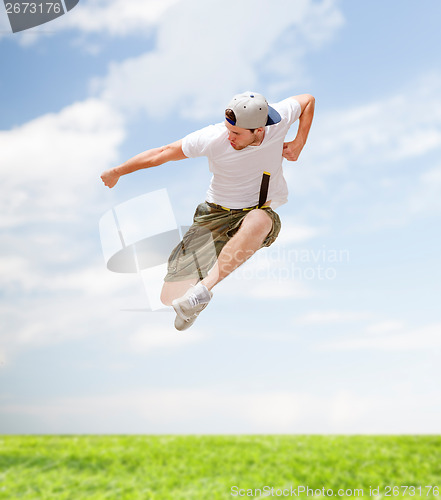 Image of male dancer jumping in the air