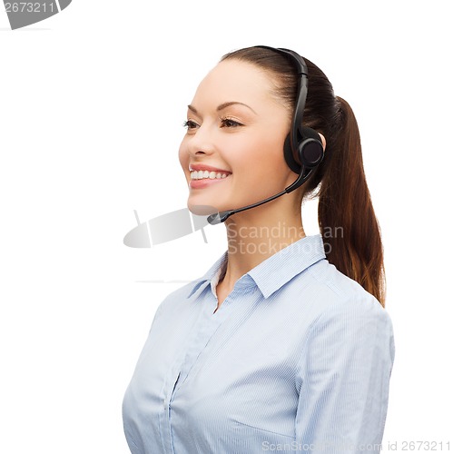 Image of friendly female helpline operator with headphones