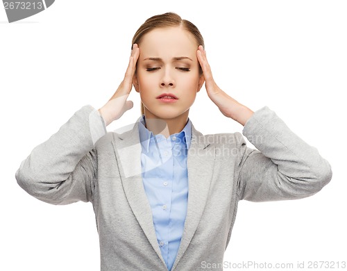 Image of stressed businesswoman having headache