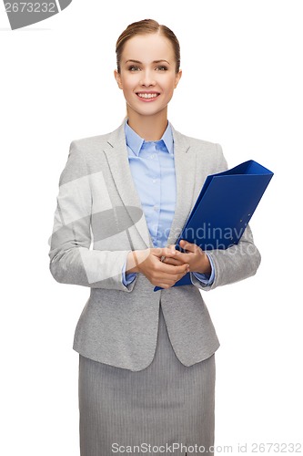 Image of smiling businesswoman with folder
