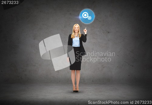 Image of attractive young businesswoman with her finger up