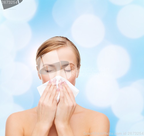 Image of beautiful woman with paper tissue