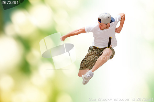 Image of male dancer jumping in the air