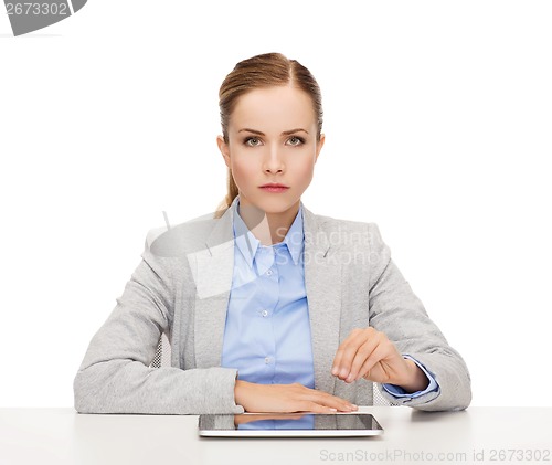 Image of smiling businesswoman with tablet pc